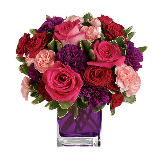 Bejeweled Beauty – Hot pink roses, red spray roses and purple carnations in a purple glass cube vase by Karen's Floral Expression, Bolingbrook