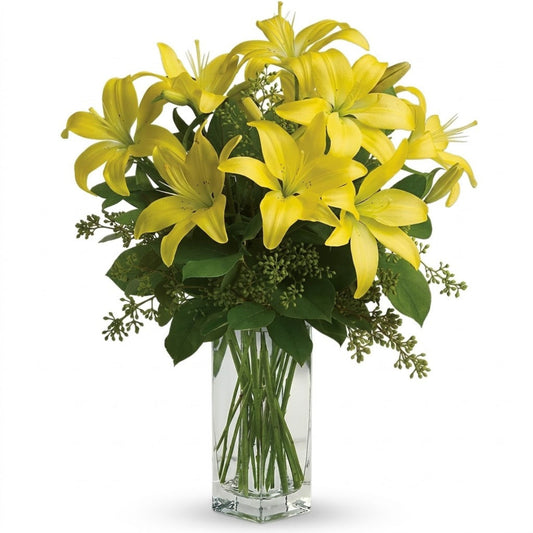 Lily Sunshine – Bold yellow Asiatic lilies and green sedum in a tall clear glass cube vase by Karen's Floral Expression, Bolingbrook

