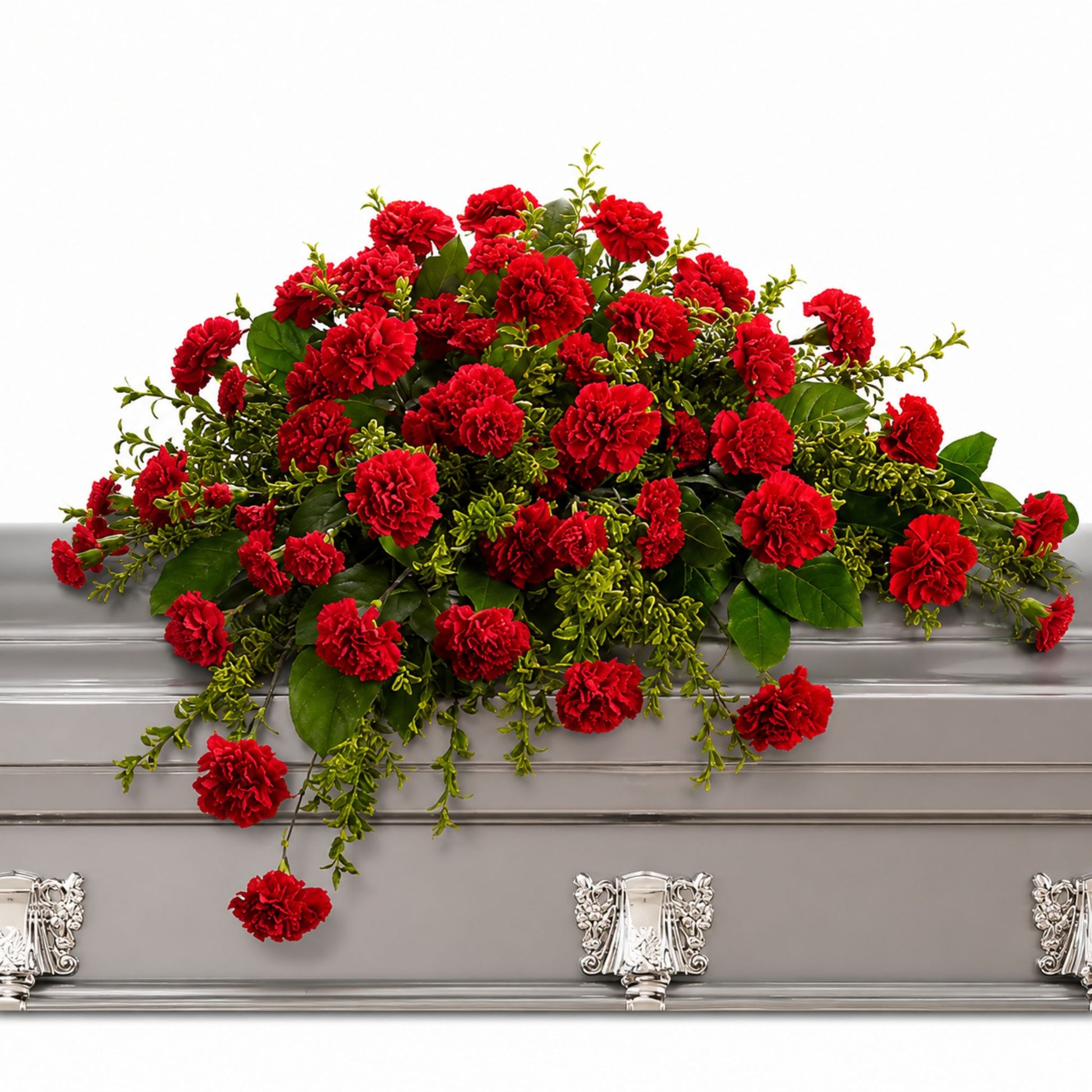 Red carnation casket spray with boxwood greenery
