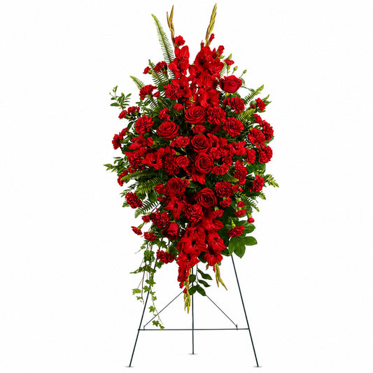 All-red rose and gladiolus funeral standing spray on easel
