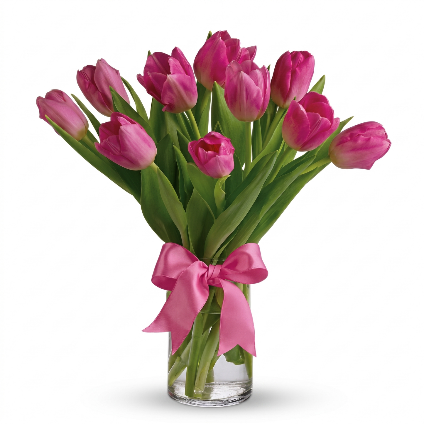 Precious pink tulips bouquet in clear glass cylinder vase with pink satin ribbon bow