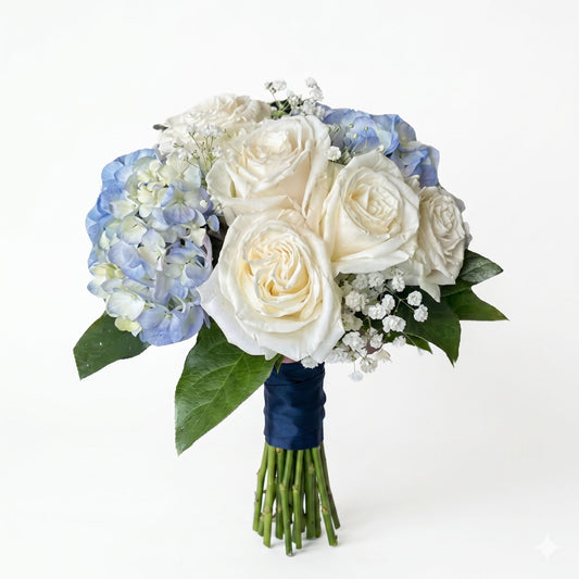 Blue and white prom hand-tied bouquet with ivory white garden roses, blue hydrangea and navy satin ribbon wrap