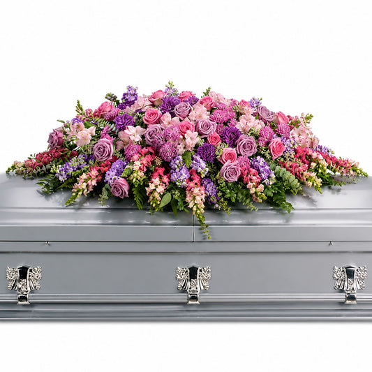 Lavender and pink rose casket spray with purple statice